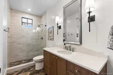 a bathroom with a shower and toilet
