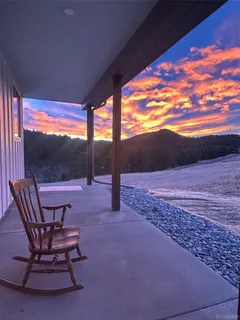 a view of a two chair in the patio