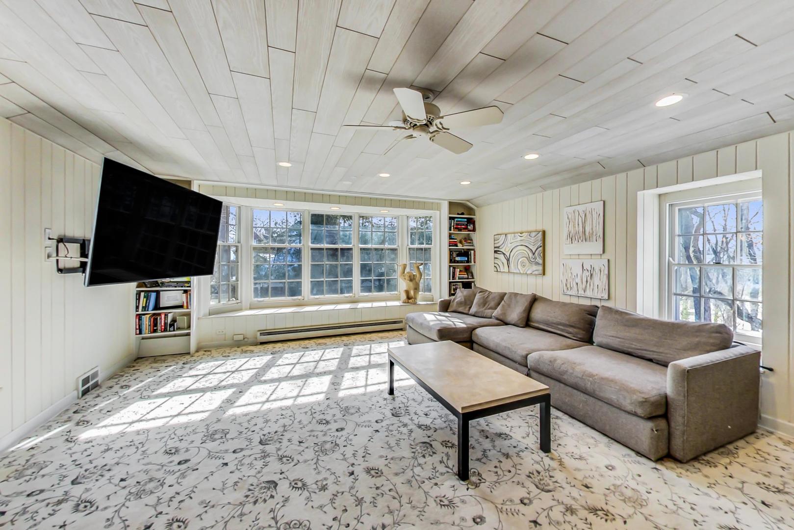 875 Fairview Road Highland Park, IL 60035 - Photo 11 of 32 a living room with furniture and a flat screen tv