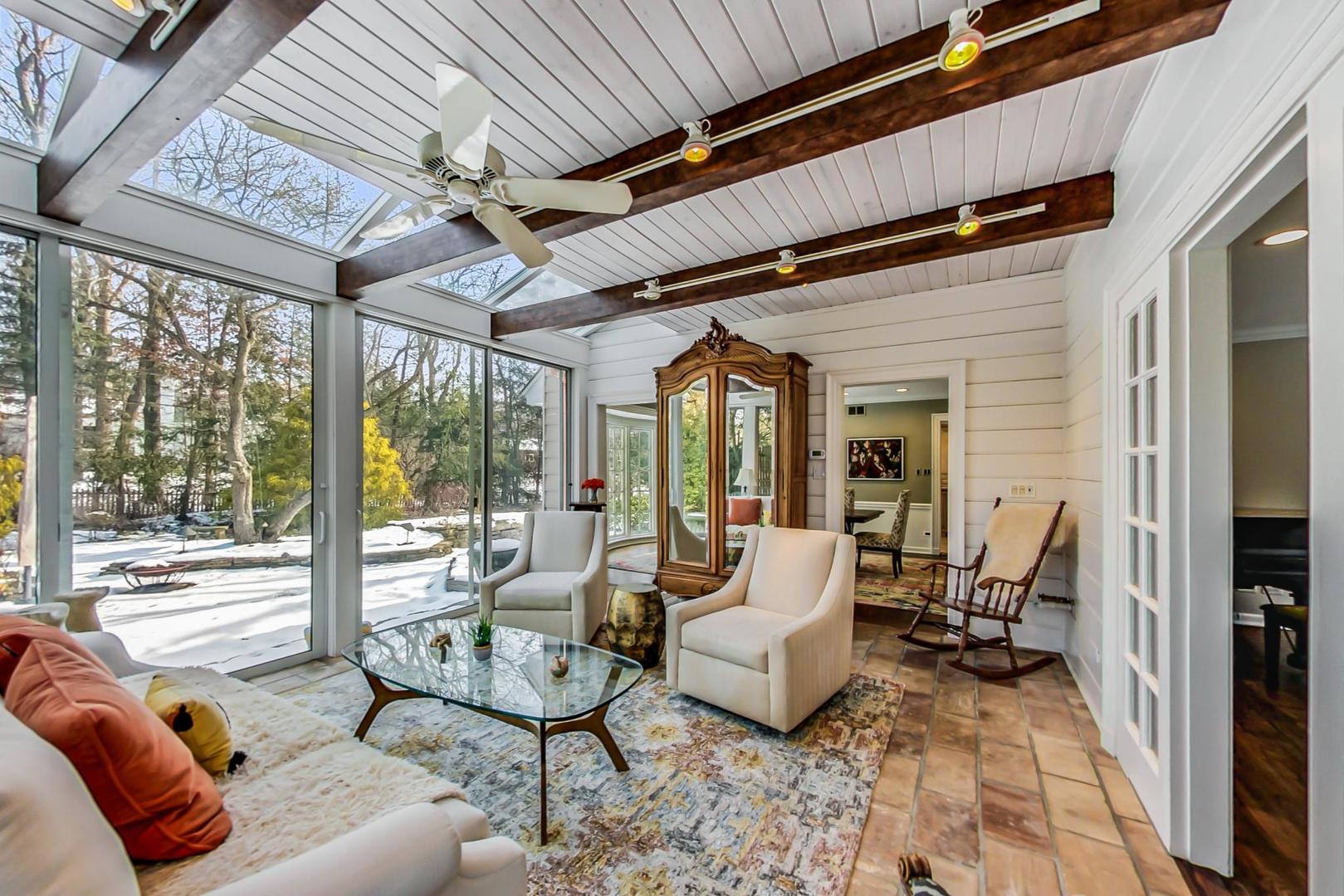 875 Fairview Road Highland Park, IL 60035 - Photo 13 of 32 a living room with furniture and a floor to ceiling window