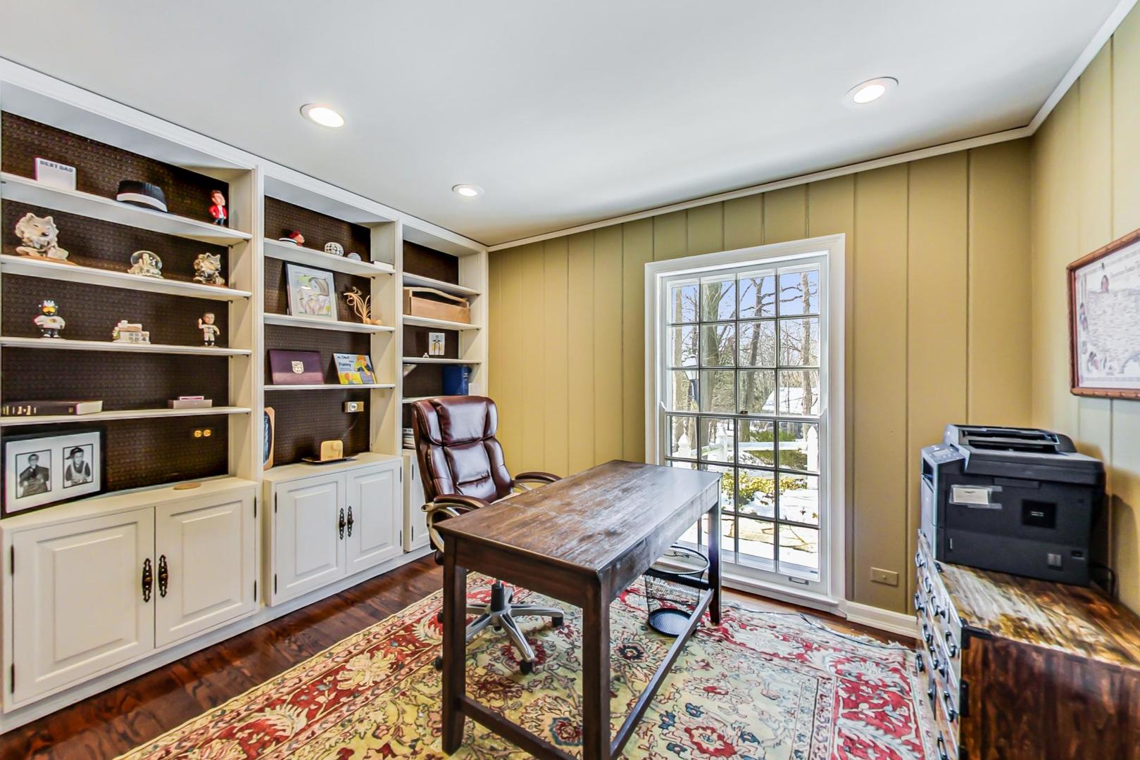 875 Fairview Road Highland Park, IL 60035 - Photo 15 of 32 a view of a workspace with furniture and wooden floor