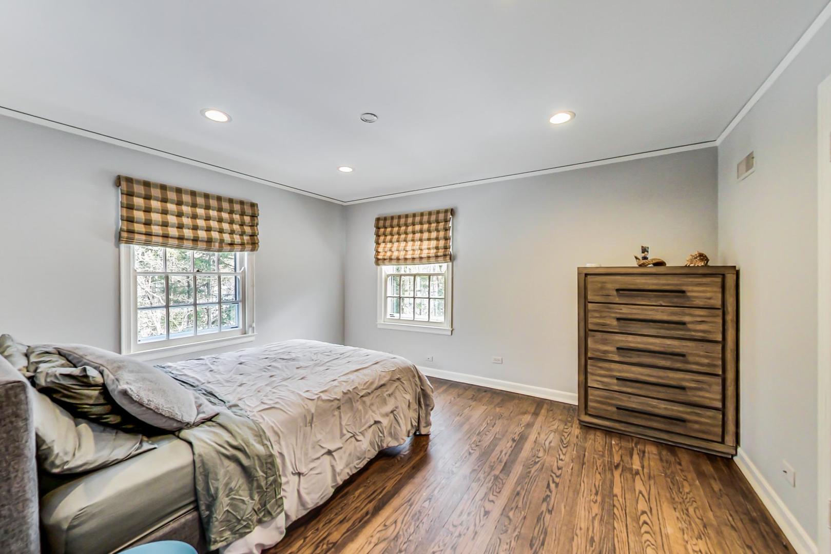 875 Fairview Road Highland Park, IL 60035 - Photo 22 of 32 a bedroom with a bed and a window