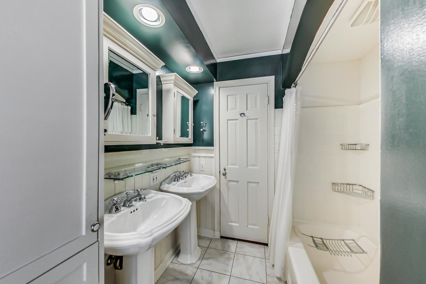 875 Fairview Road Highland Park, IL 60035 - Photo 23 of 32 a bathroom with a sink toilet and shower