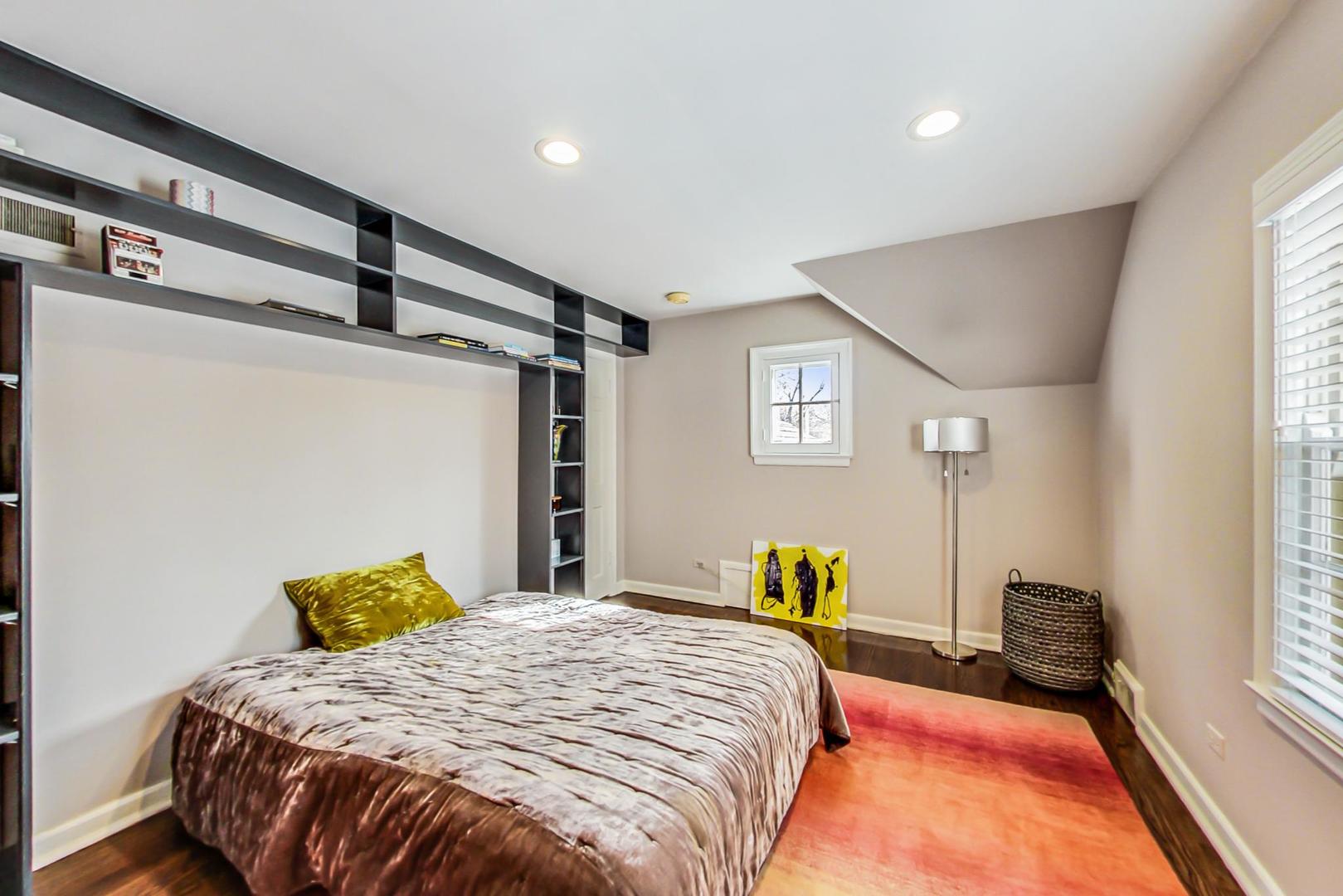 875 Fairview Road Highland Park, IL 60035 - Photo 24 of 32 a bedroom with a bed and a window