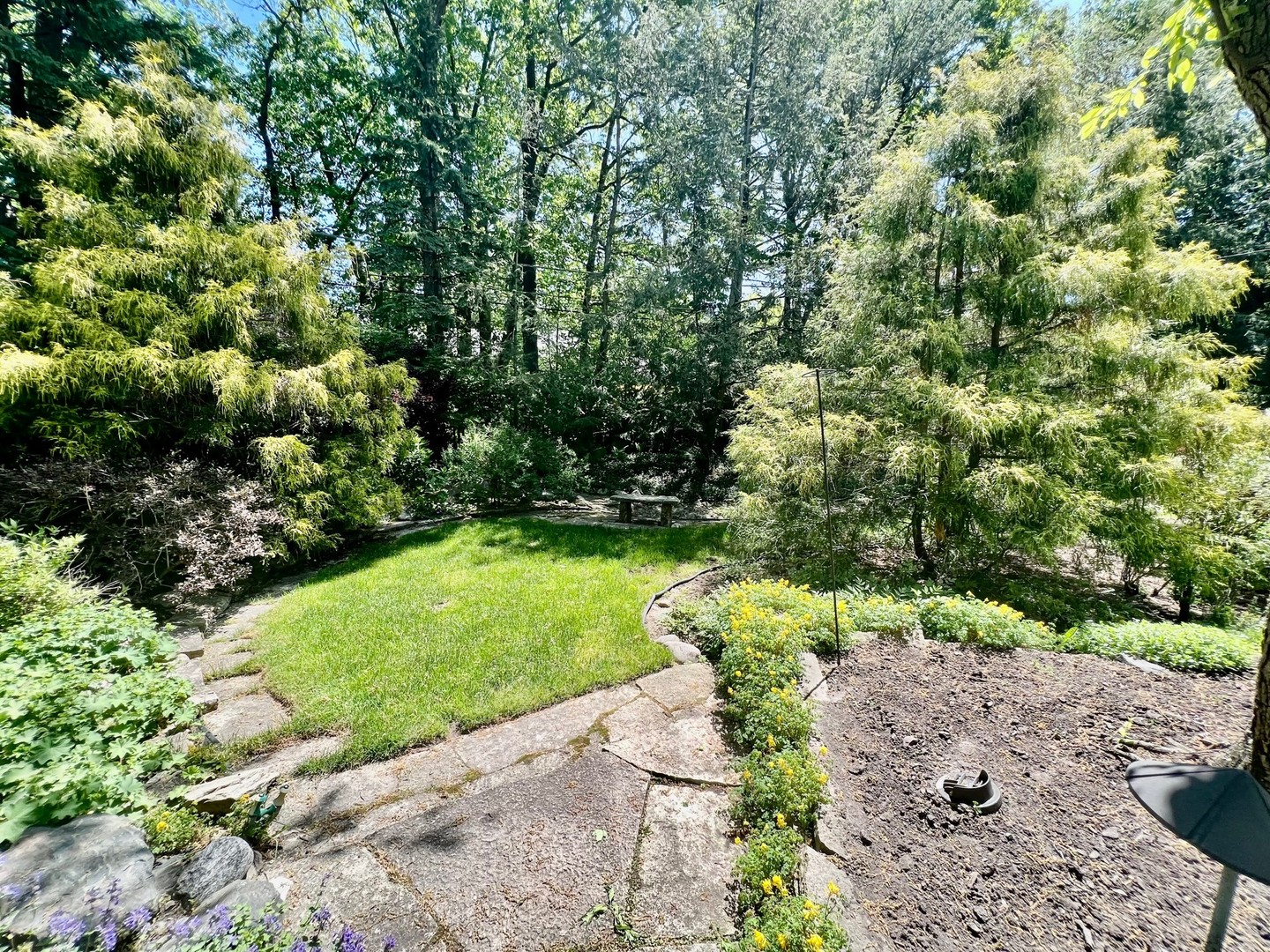 875 Fairview Road Highland Park, IL 60035 - Photo 28 of 32 a view of a garden with a tree