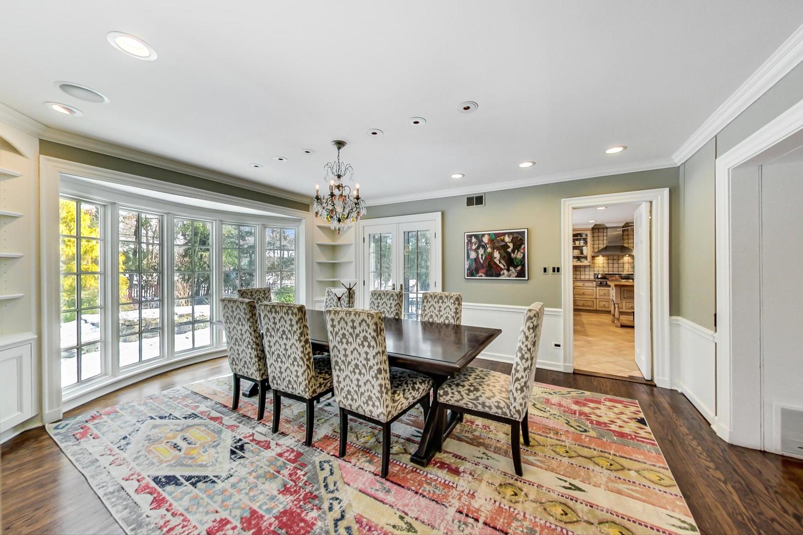 875 Fairview Road Highland Park, IL 60035 - Photo 6 of 32 a dining room with wooden floor and a rug