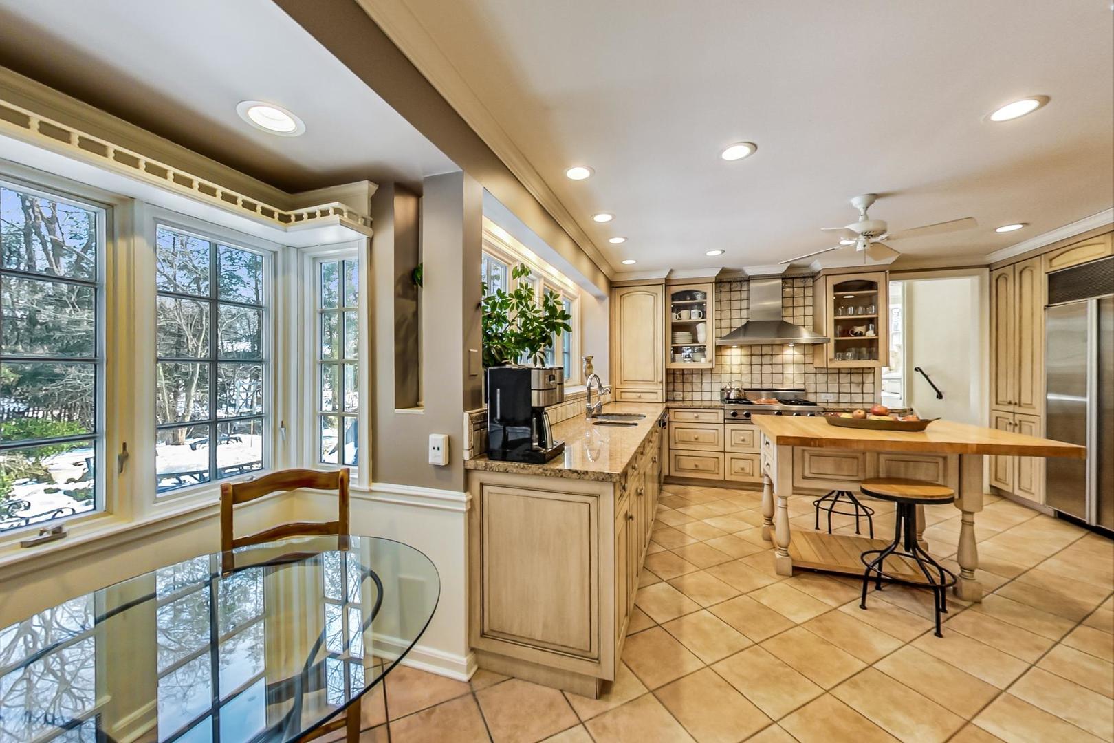 875 Fairview Road Highland Park, IL 60035 - Photo 9 of 32 a very nice looking living room with a large window and furniture