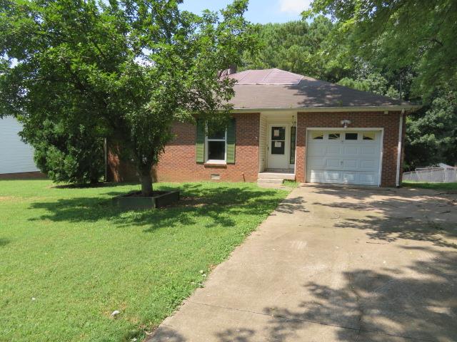 823 Hadley Road Clarksville, TN 37042 - Photo 1 of 14 a front view of a house with yard and green space