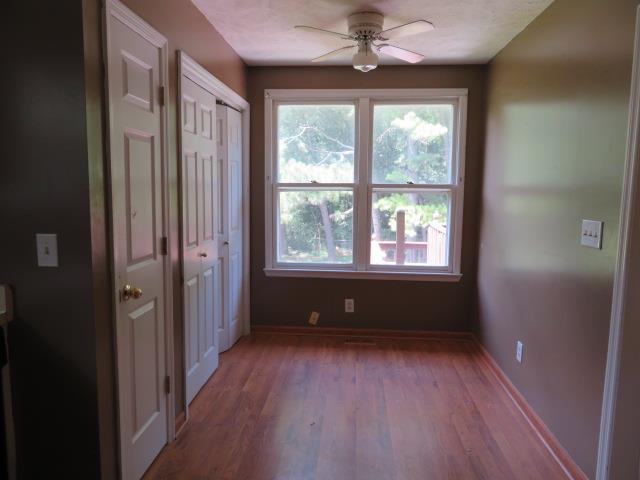 823 Hadley Road Clarksville, TN 37042 - Photo 6 of 14 a view of workspace with wooden floor and windows