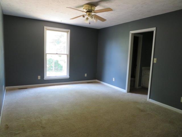 823 Hadley Road Clarksville, TN 37042 - Photo 8 of 14 an empty room with windows and fan