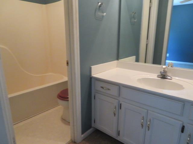 823 Hadley Road Clarksville, TN 37042 - Photo 9 of 14 a bathroom with a sink a toilet and shower