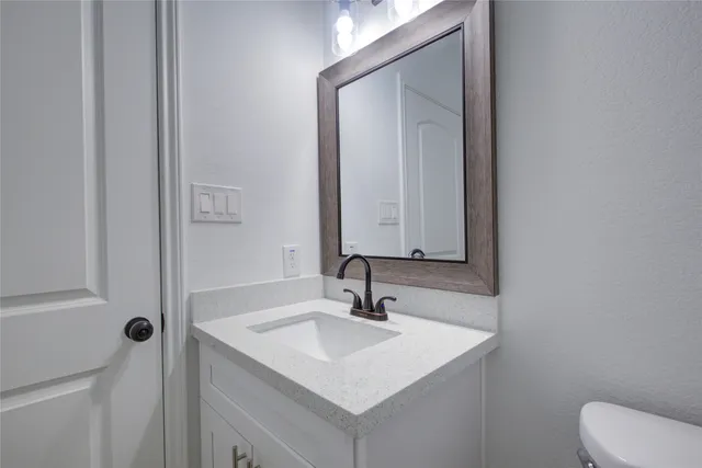 a bathroom with a double vanity sink