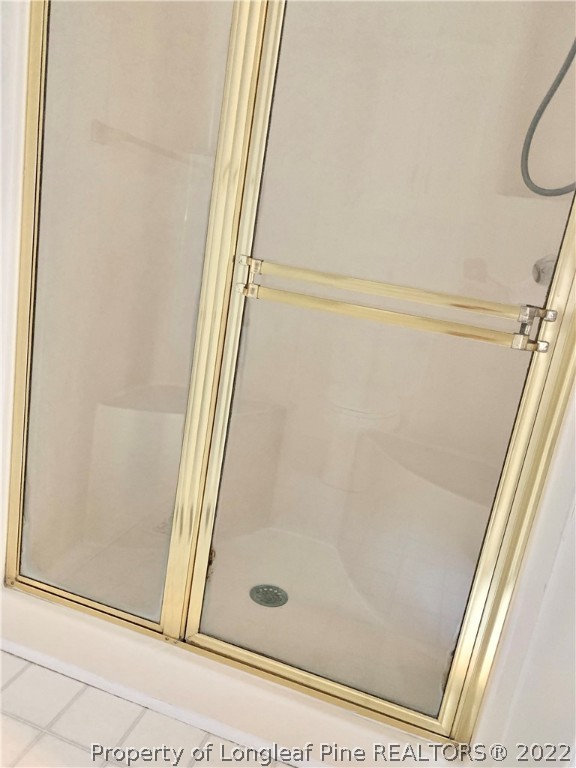 7800 Trappers Road Fayetteville, NC 28311 - Photo 12 of 20 a bathroom with a glass shower door