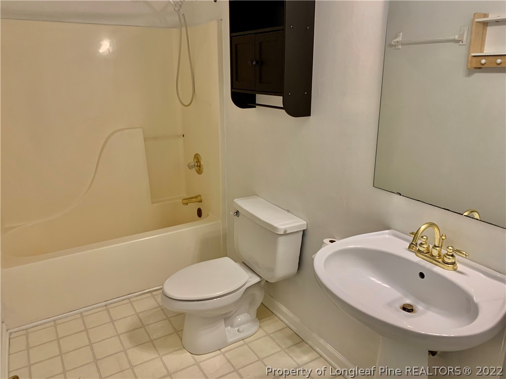 7800 Trappers Road Fayetteville, NC 28311 - Photo 14 of 20 a bathroom with a sink toilet and shower