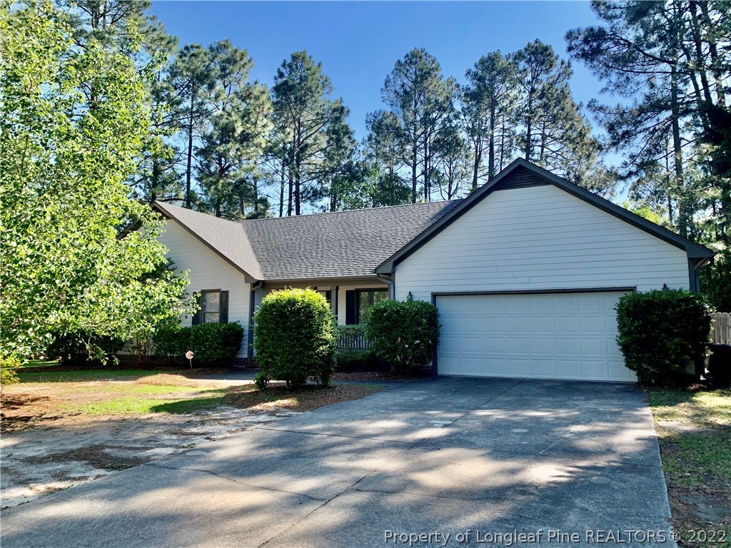 7800 Trappers Road Fayetteville, NC 28311 - Photo 2 of 20 a front view of a house with garden