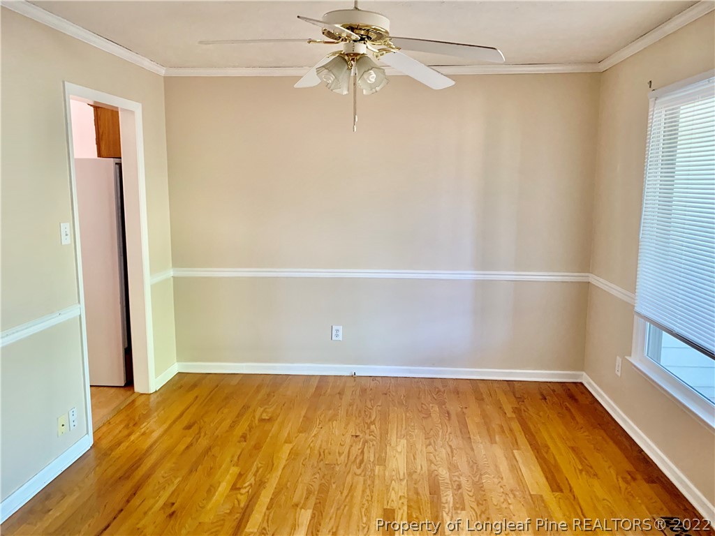 7800 Trappers Road Fayetteville, NC 28311 - Photo 3 of 20 a view of an empty room with wooden floor and a window