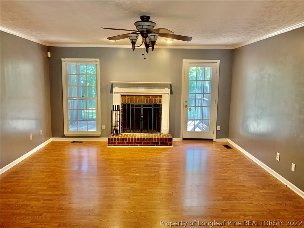 7800 Trappers Road Fayetteville, NC 28311 - Photo 4 of 20 a view of an empty room with window and fire place