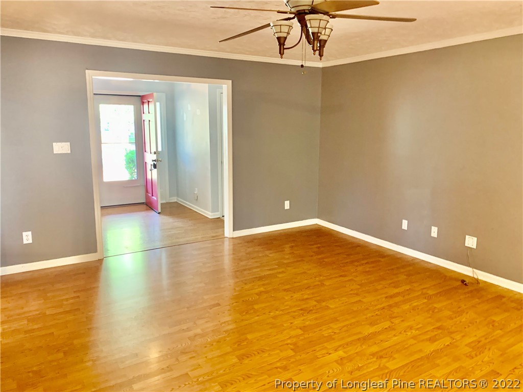 7800 Trappers Road Fayetteville, NC 28311 - Photo 7 of 20 a view of empty room with wooden floor