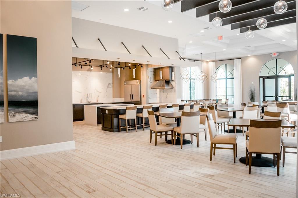 5542 Useppa Drive Ave Maria, FL 34142 - Photo 15 of 15 a living room with lots of furniture and wooden floor