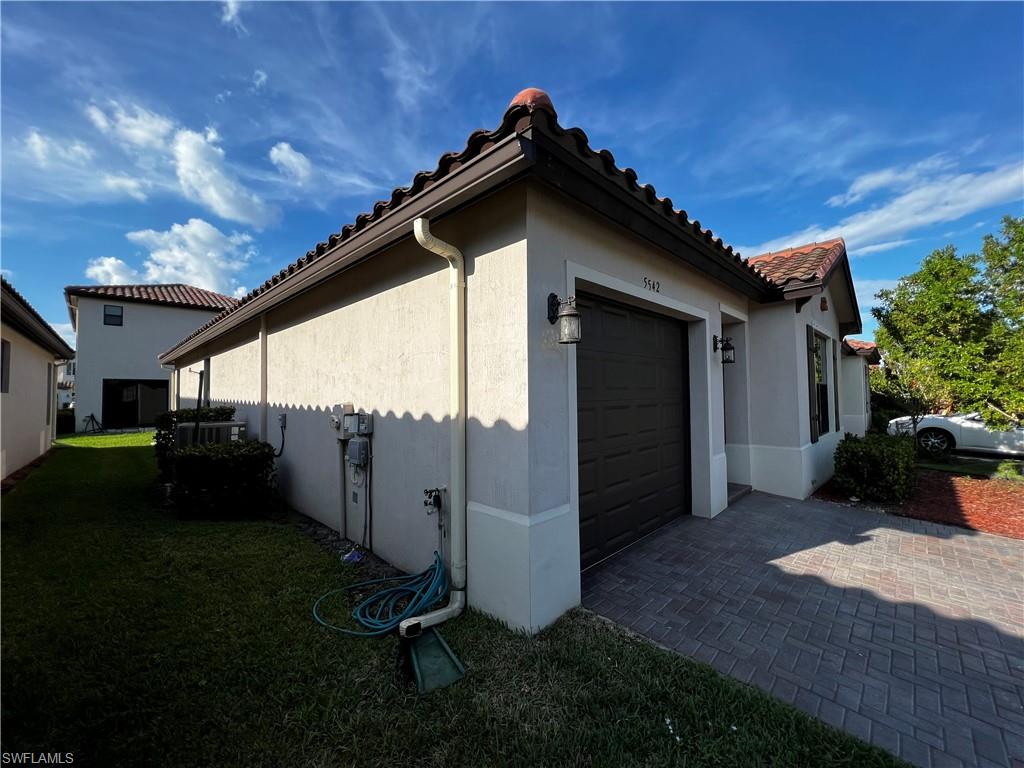5542 Useppa Drive Ave Maria, FL 34142 - Photo 2 of 15 a view of a porch with a yard
