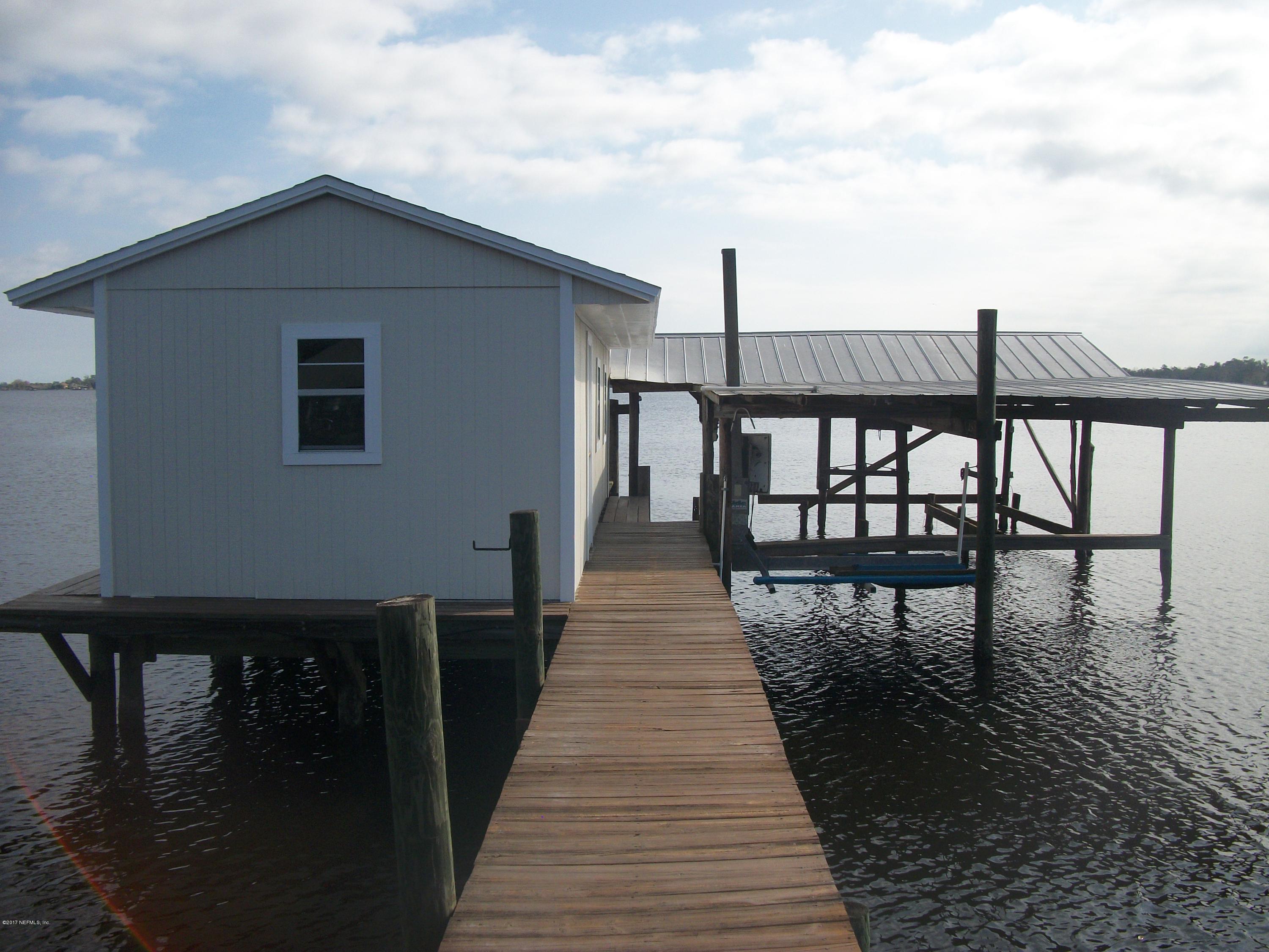255 Brickyard Road Middleburg, FL 32068 - Photo 56 of 62 a view of a balcony with wooden floor and lake view