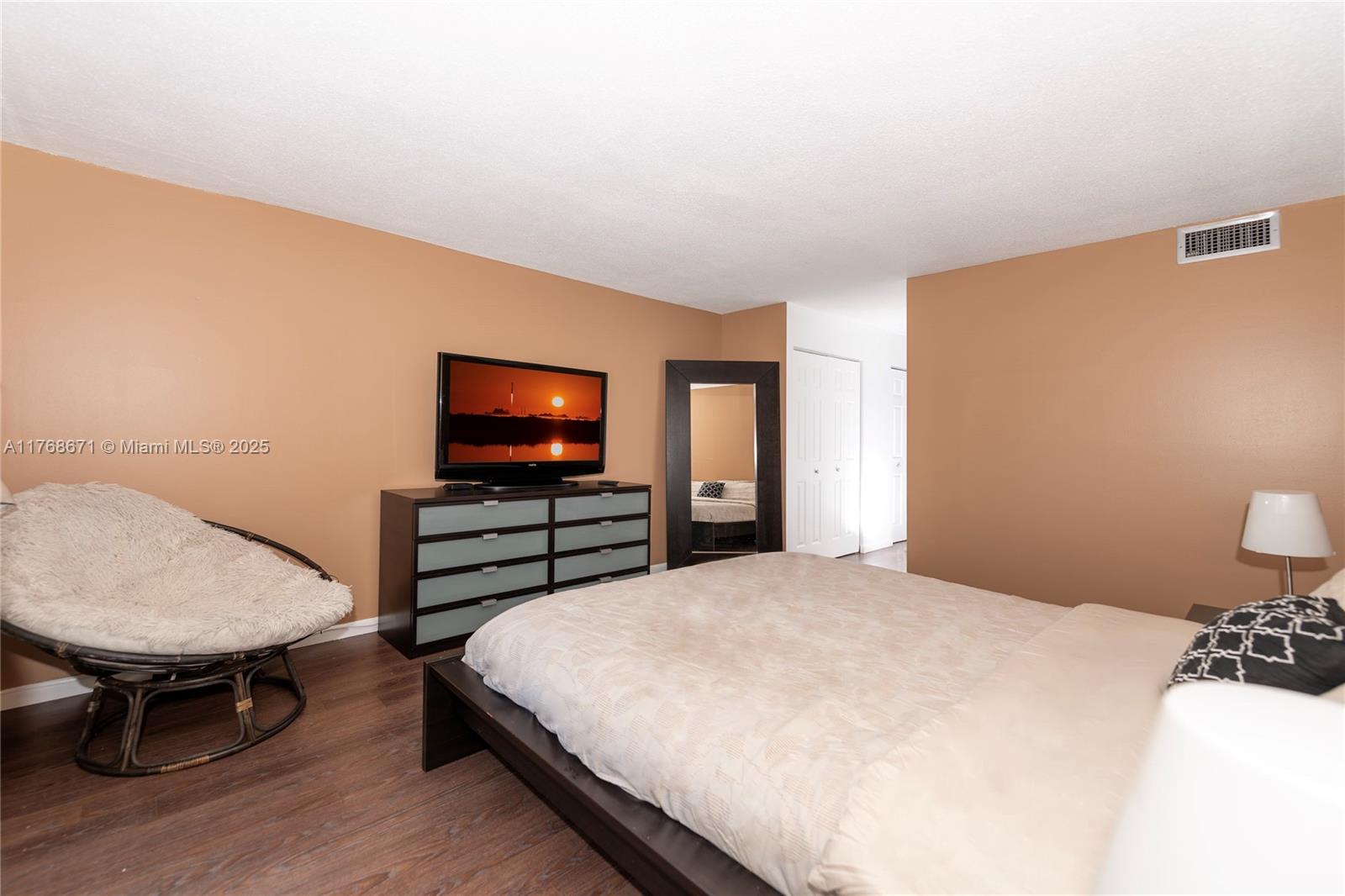 2750 Northeast 183rd Street, Unit 1207 Aventura, FL 33160 - Photo 17 of 21 a bedroom with a bed and a flat screen tv