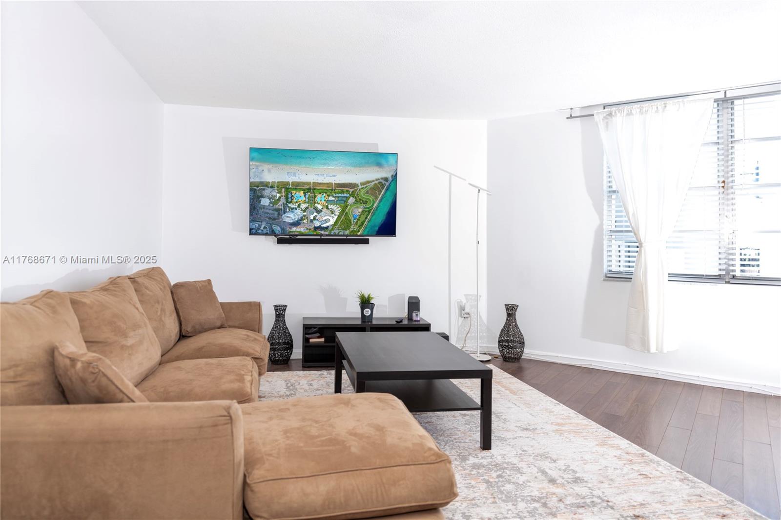 2750 Northeast 183rd Street, Unit 1207 Aventura, FL 33160 - Photo 20 of 21 a living room with furniture and a window
