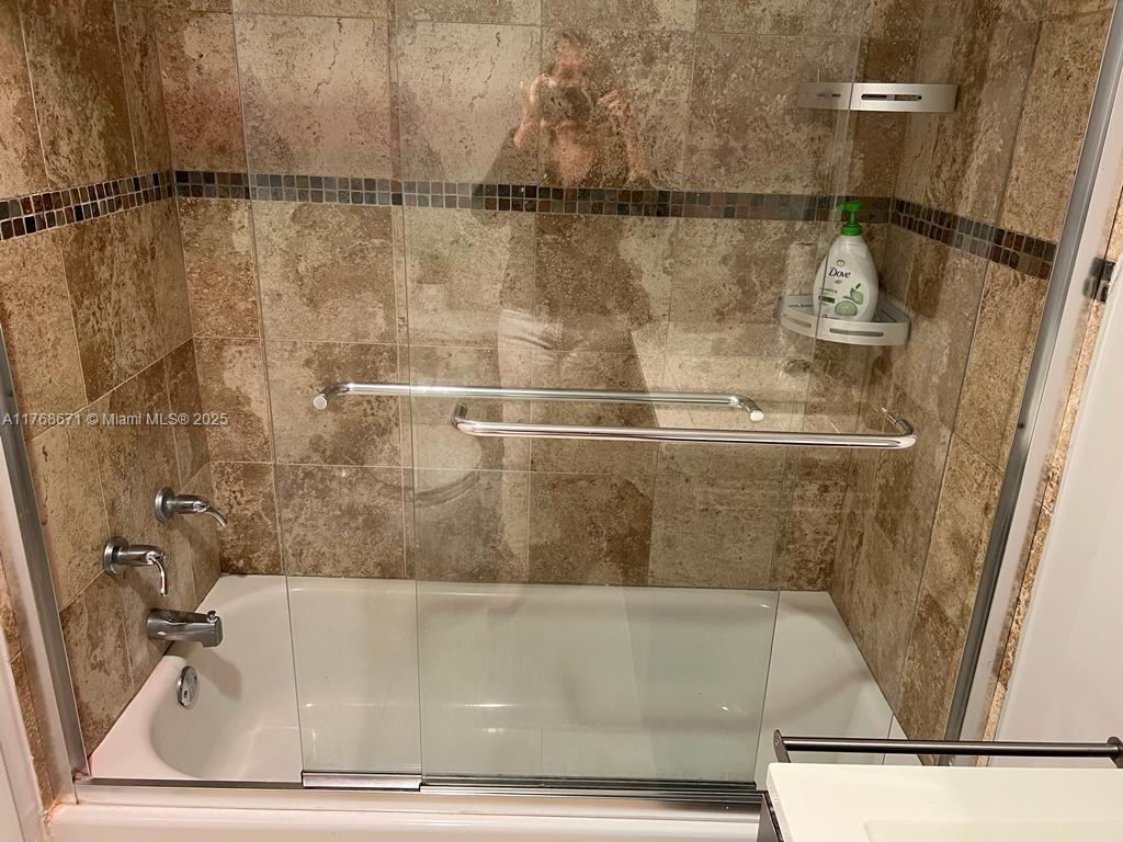 2750 Northeast 183rd Street, Unit 1207 Aventura, FL 33160 - Photo 5 of 21 a bathroom with a shower