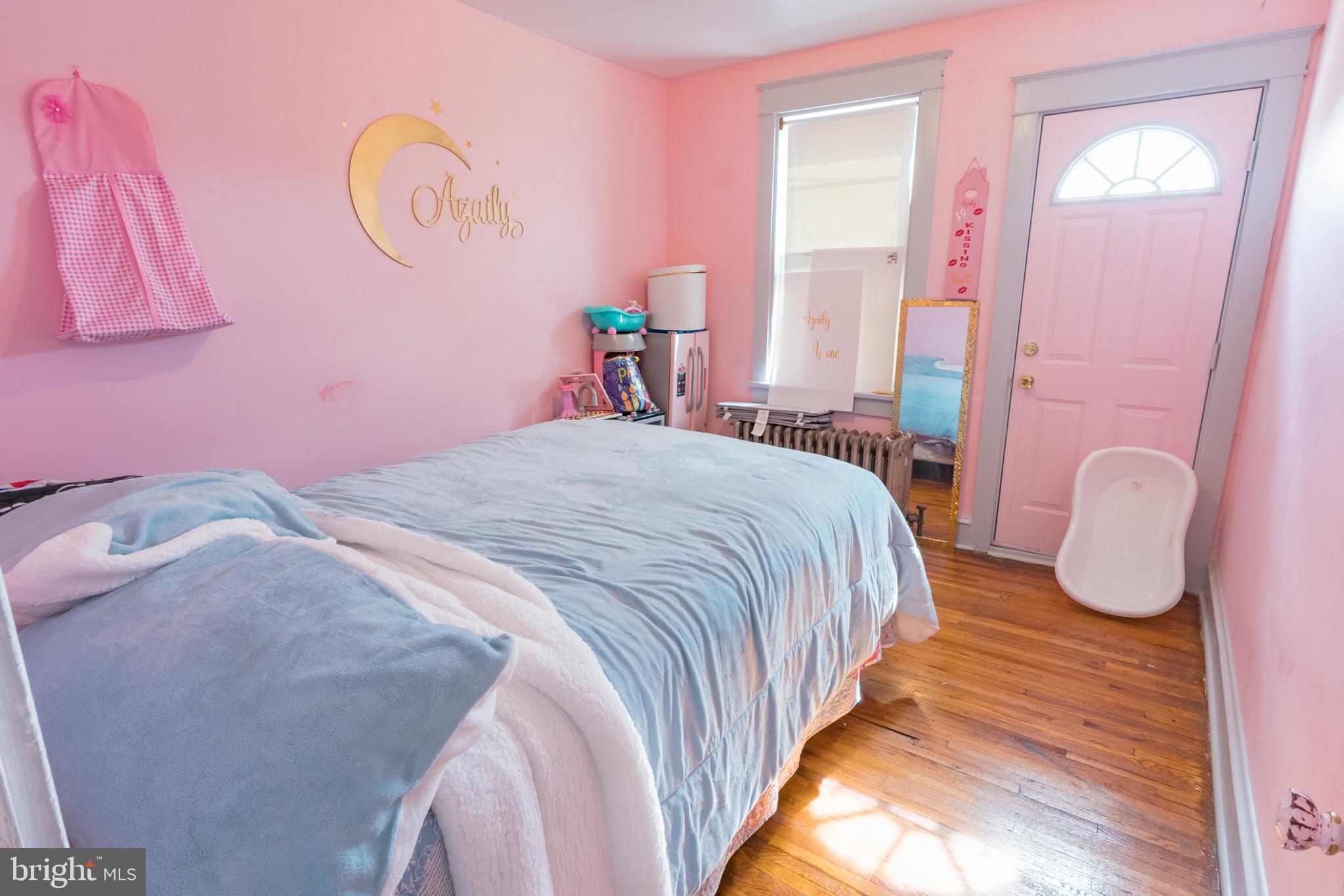 1020 Meade Street Reading, PA 19611 - Photo 20 of 28 a bedroom with a bed and a chandelier