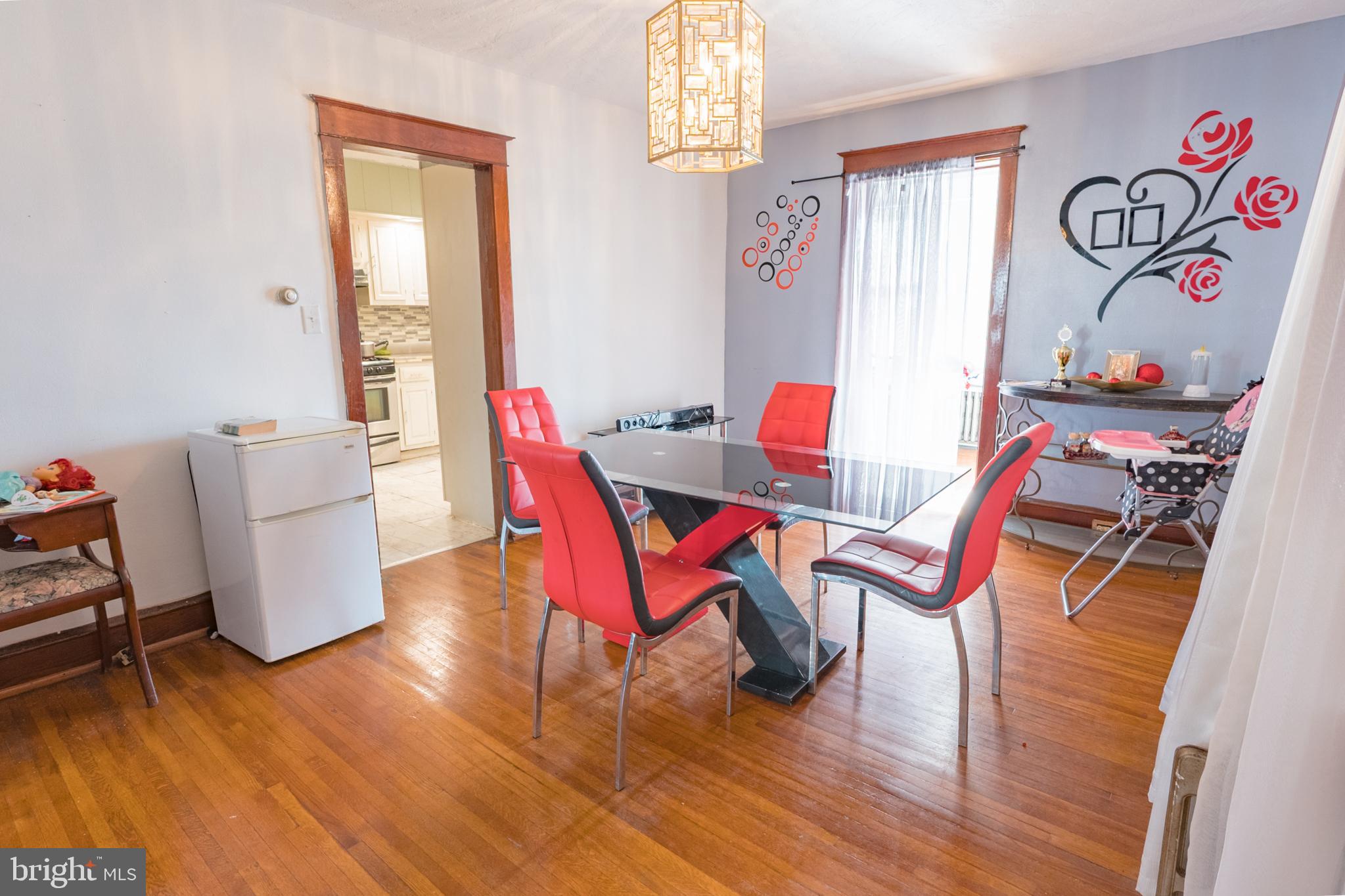 1020 Meade Street Reading, PA 19611 - Photo 7 of 28 a dining room with furniture and wooden floor