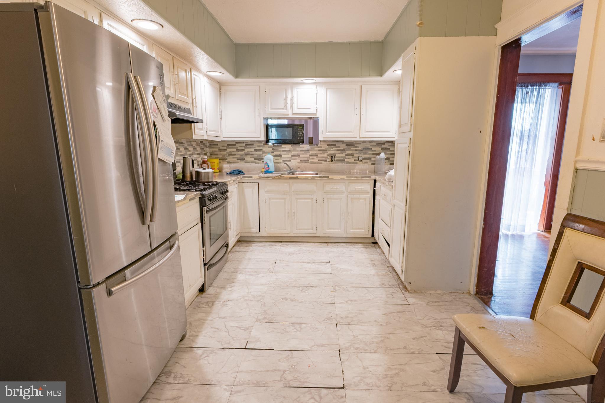 1020 Meade Street Reading, PA 19611 - Photo 9 of 28 a kitchen with a refrigerator stove and sink