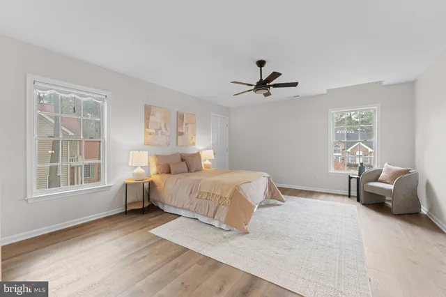 an empty room with a empty space and windows