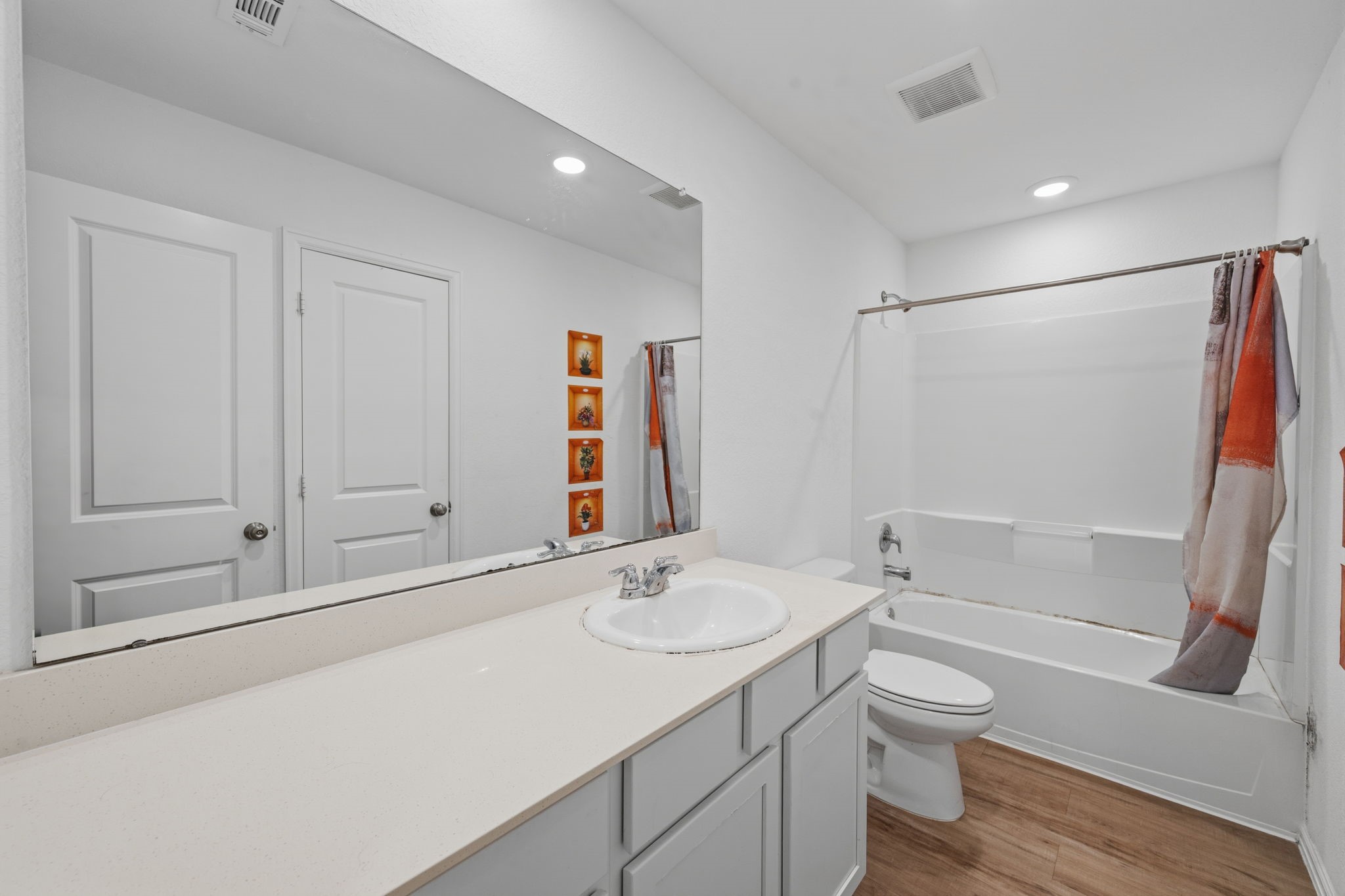 3043 Marble Rise Trail Porter, TX 77365 - Photo 16 of 27 Bright and modern bathroom featuring a spacious vanity, sleek fixtures, and a full bathtub with a shower.