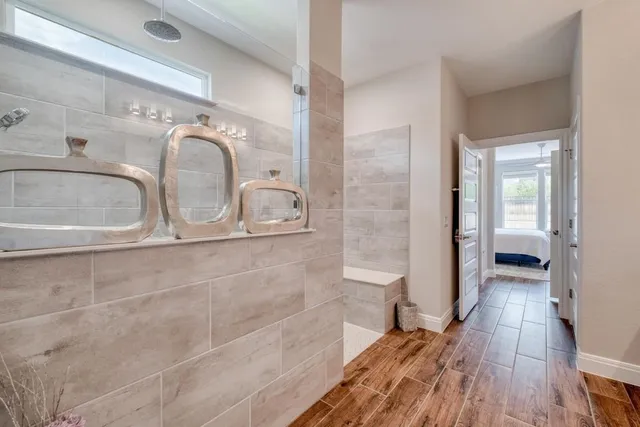 a bathroom with a granite countertop shower