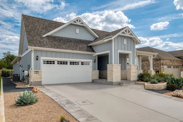a front view of a house with garage