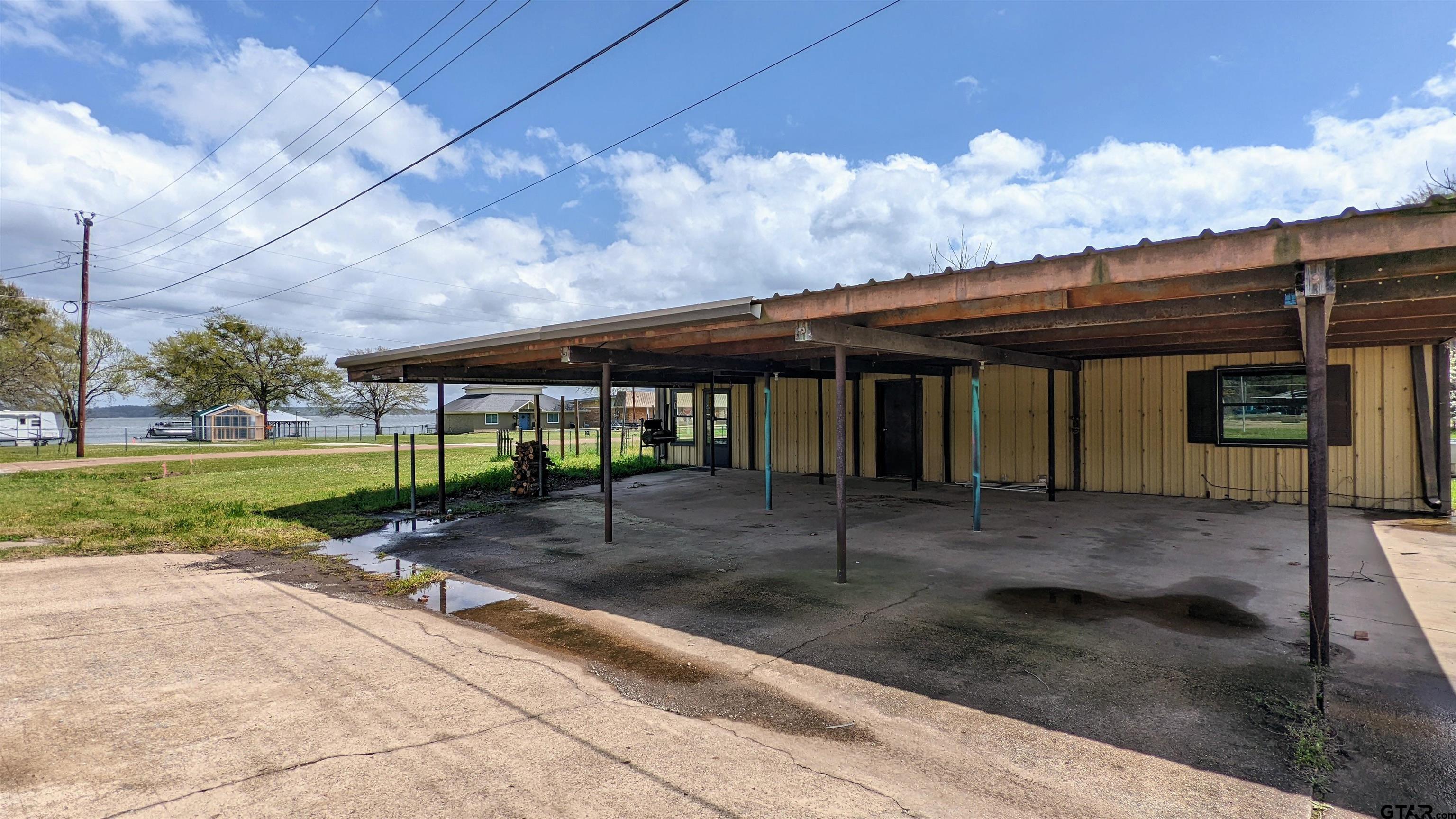 4584 Sunrise Drive Chandler, TX 75758 - Photo 1 of 28 a view of a house with backyard porch and sitting area