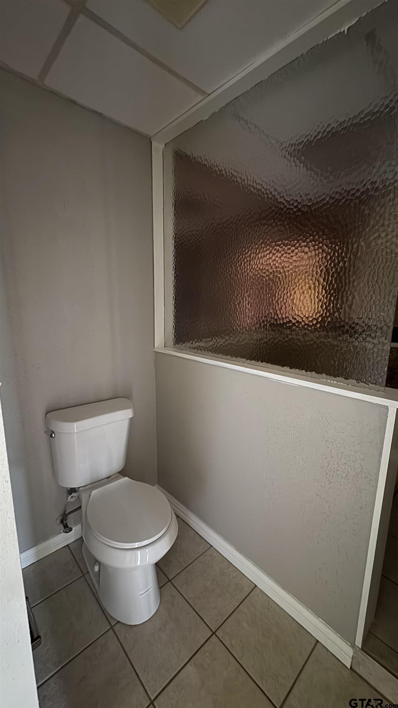 4584 Sunrise Drive Chandler, TX 75758 - Photo 11 of 28 a white toilet sitting next to a shower