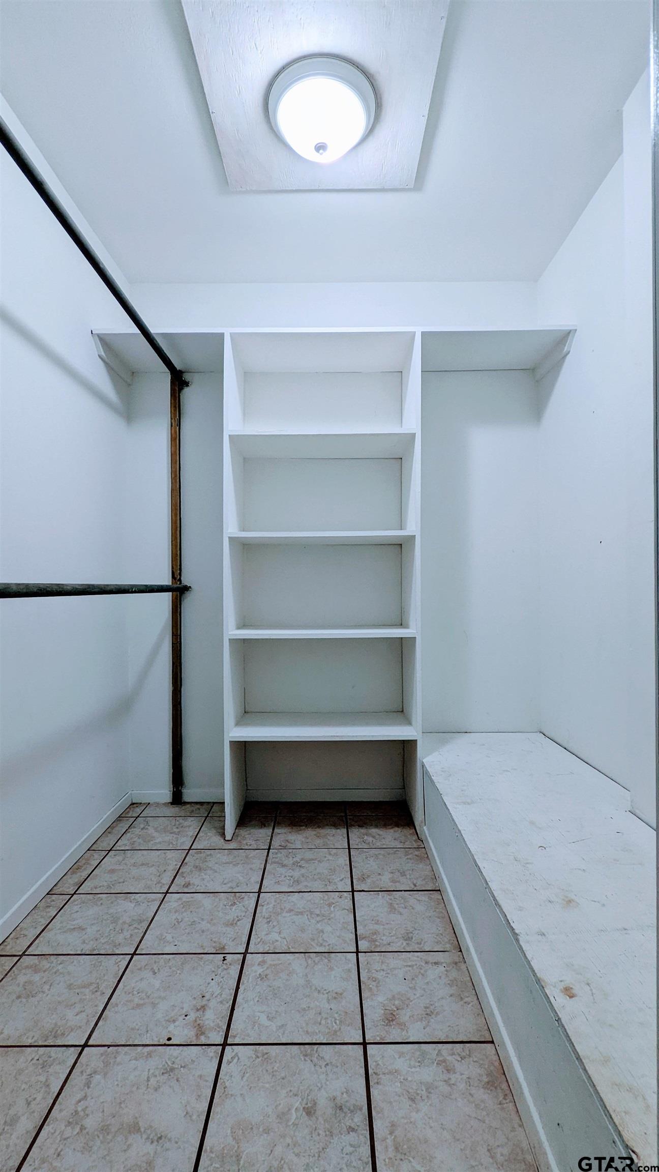 4584 Sunrise Drive Chandler, TX 75758 - Photo 13 of 28 a bathroom with a vanity and a shower