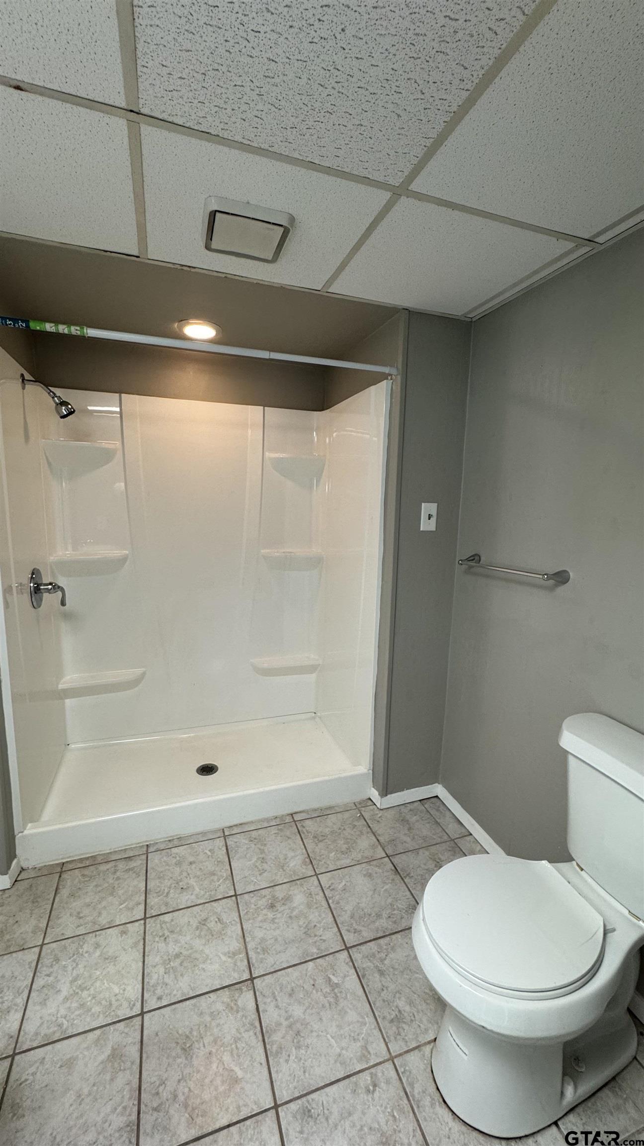 4584 Sunrise Drive Chandler, TX 75758 - Photo 16 of 28 a bathroom with a toilet and a shower