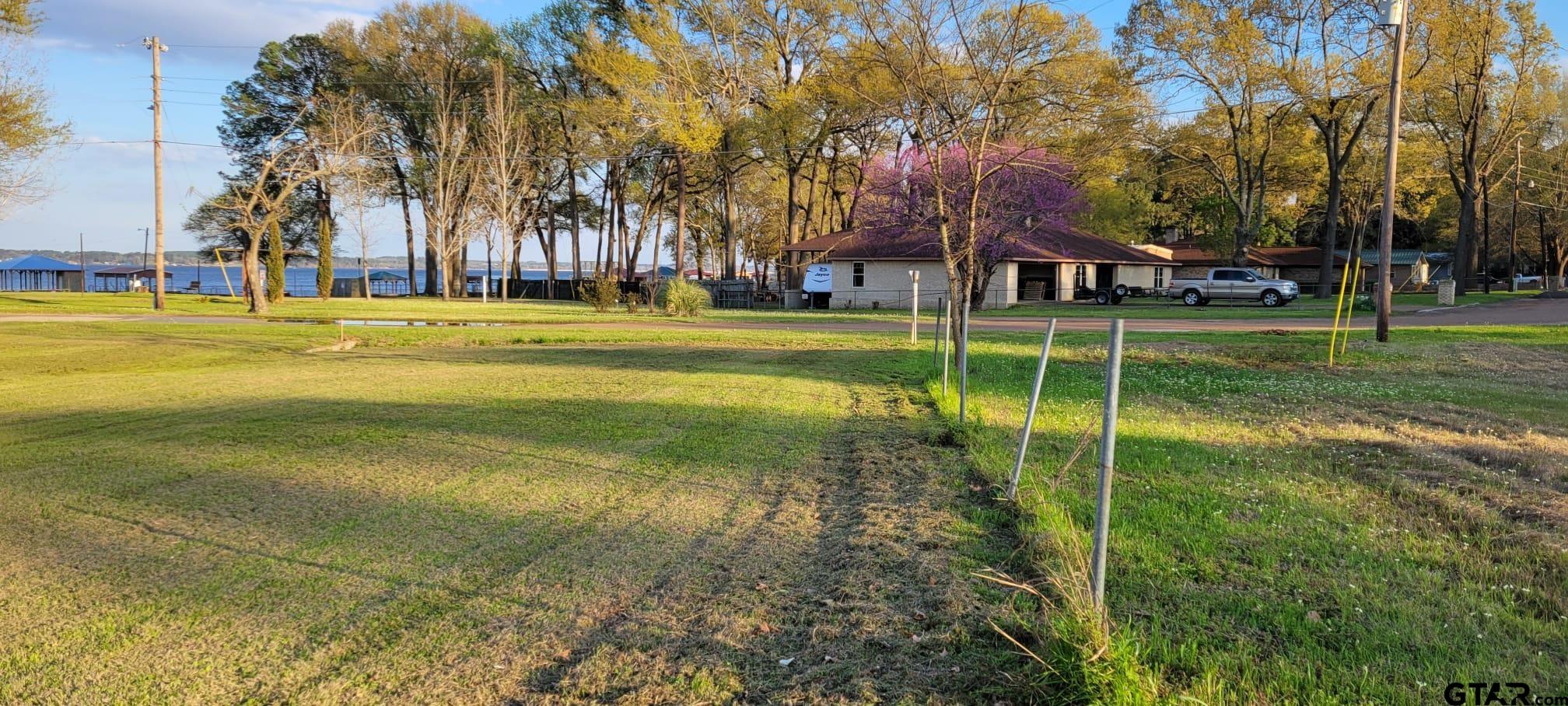 4584 Sunrise Drive Chandler, TX 75758 - Photo 19 of 28 a view of swimming pool and trees in the background