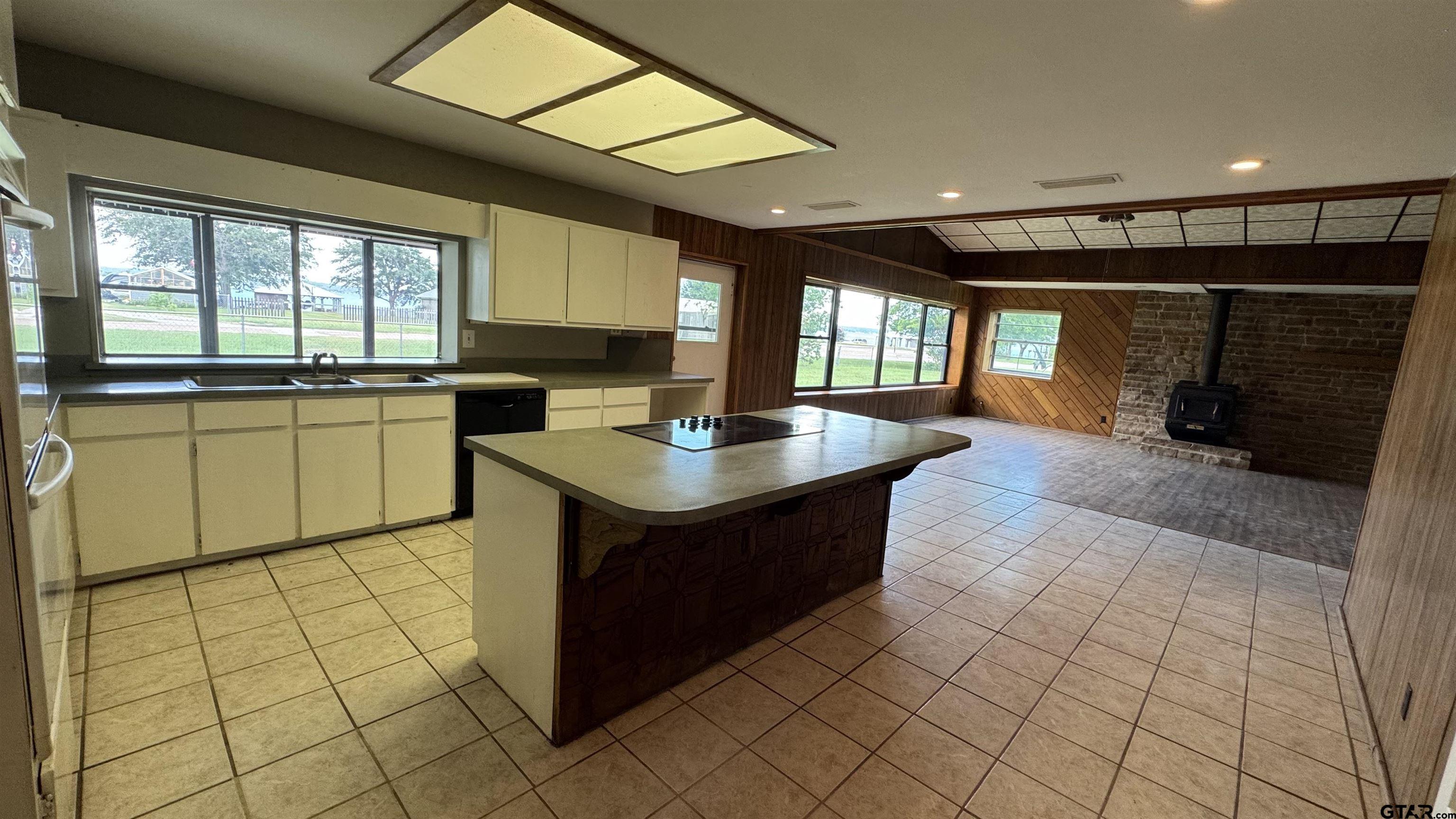 4584 Sunrise Drive Chandler, TX 75758 - Photo 2 of 28 a kitchen with stainless steel appliances granite countertop a sink and a counter top space