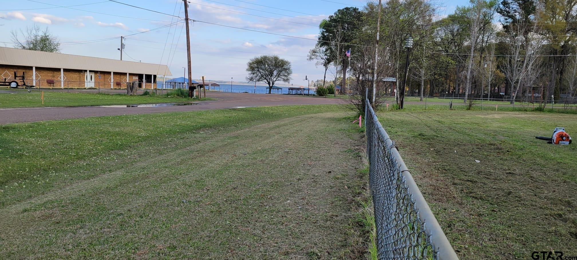 4584 Sunrise Drive Chandler, TX 75758 - Photo 25 of 28 a backyard of a house with lots of green space