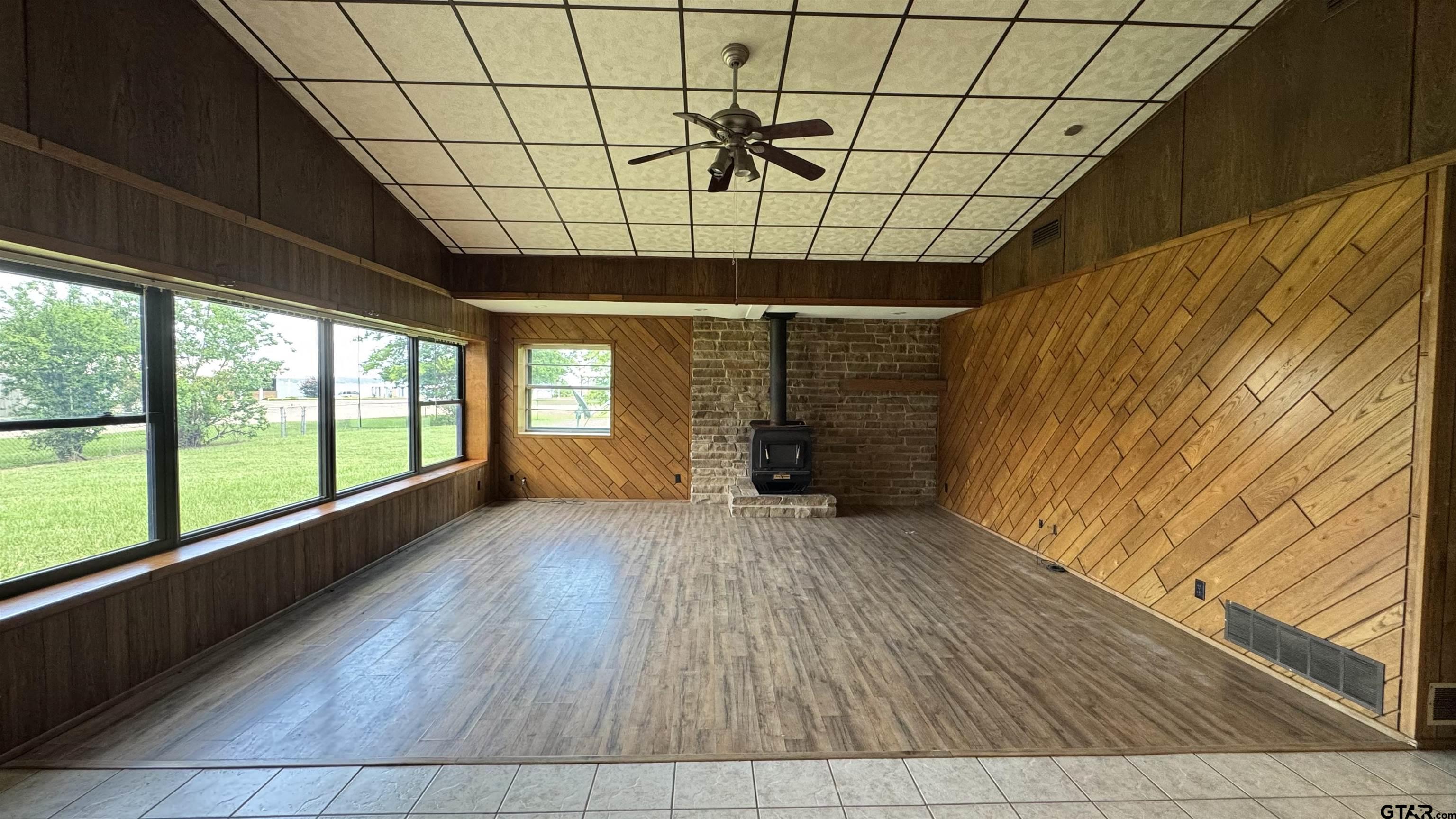 4584 Sunrise Drive Chandler, TX 75758 - Photo 4 of 28 a view of empty room with wooden floor and fan