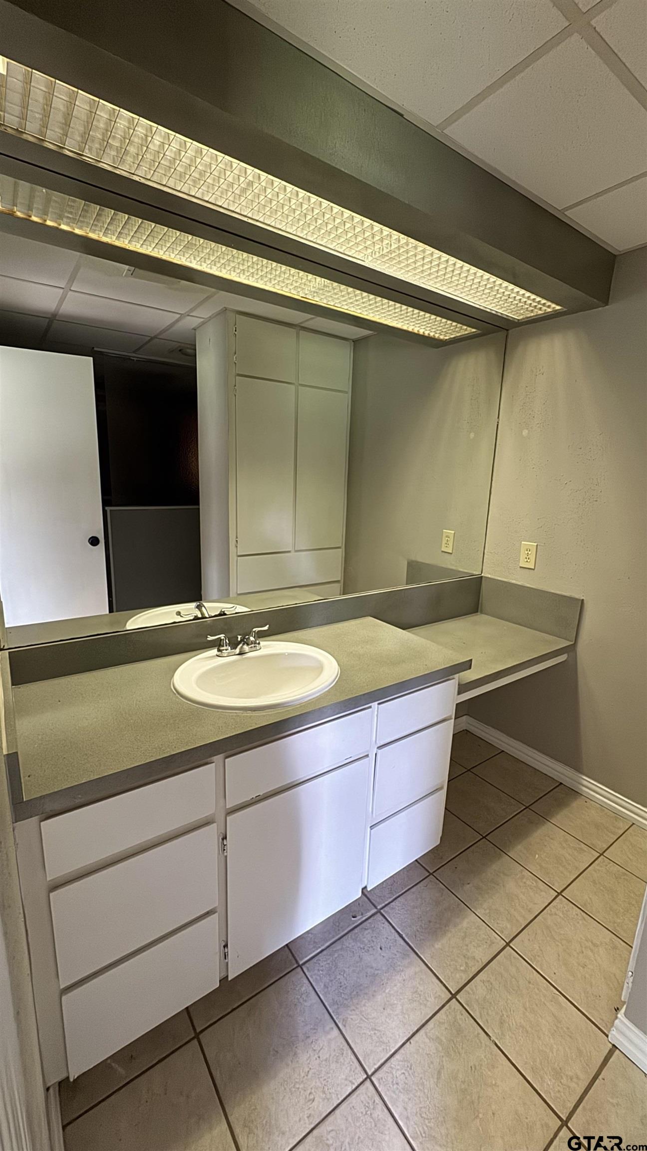 4584 Sunrise Drive Chandler, TX 75758 - Photo 10 of 28 a bathroom with a sink and a mirror