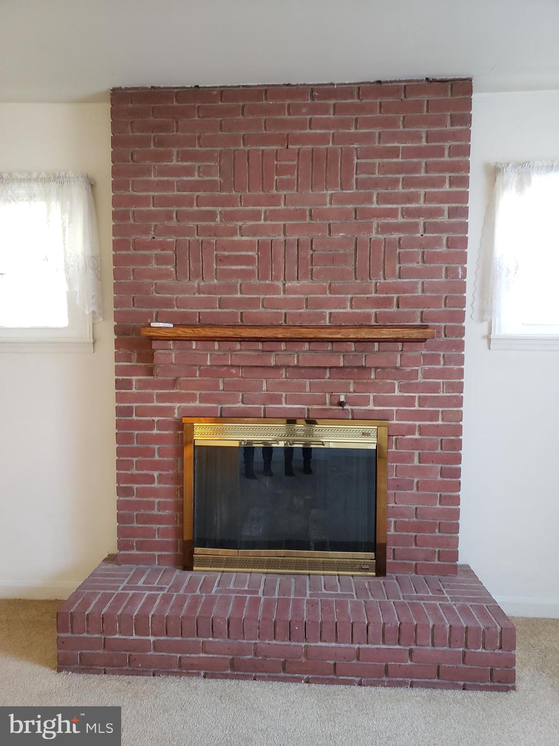 12916 Community Road Baltimore, MD 21220 - Photo 17 of 25 Brick Hearth Woodburning FP