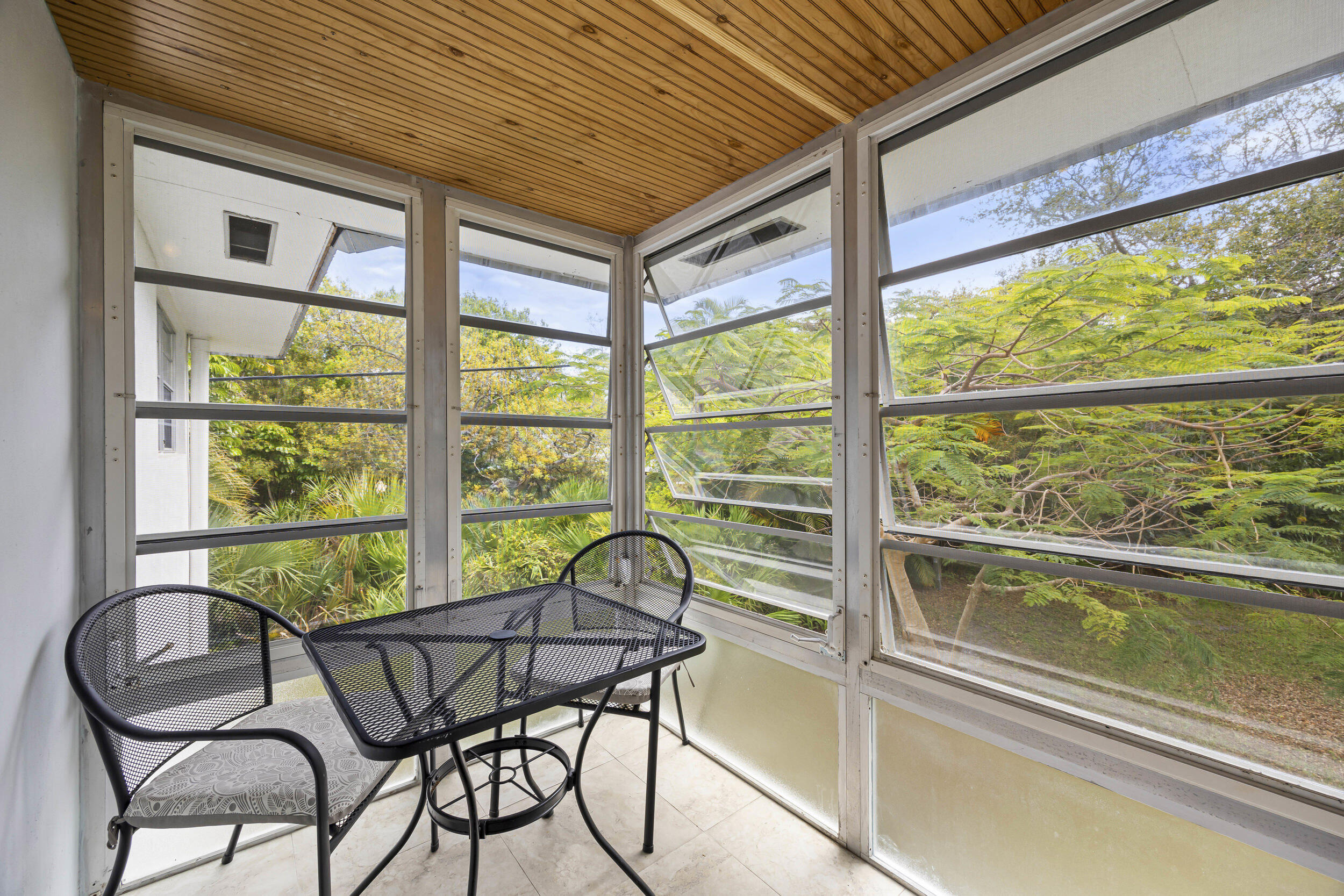 2929 Southeast Ocean Boulevard, Unit 10510 Stuart, FL 34996 - Photo 15 of 37 a view of a chairs and table in the balcony
