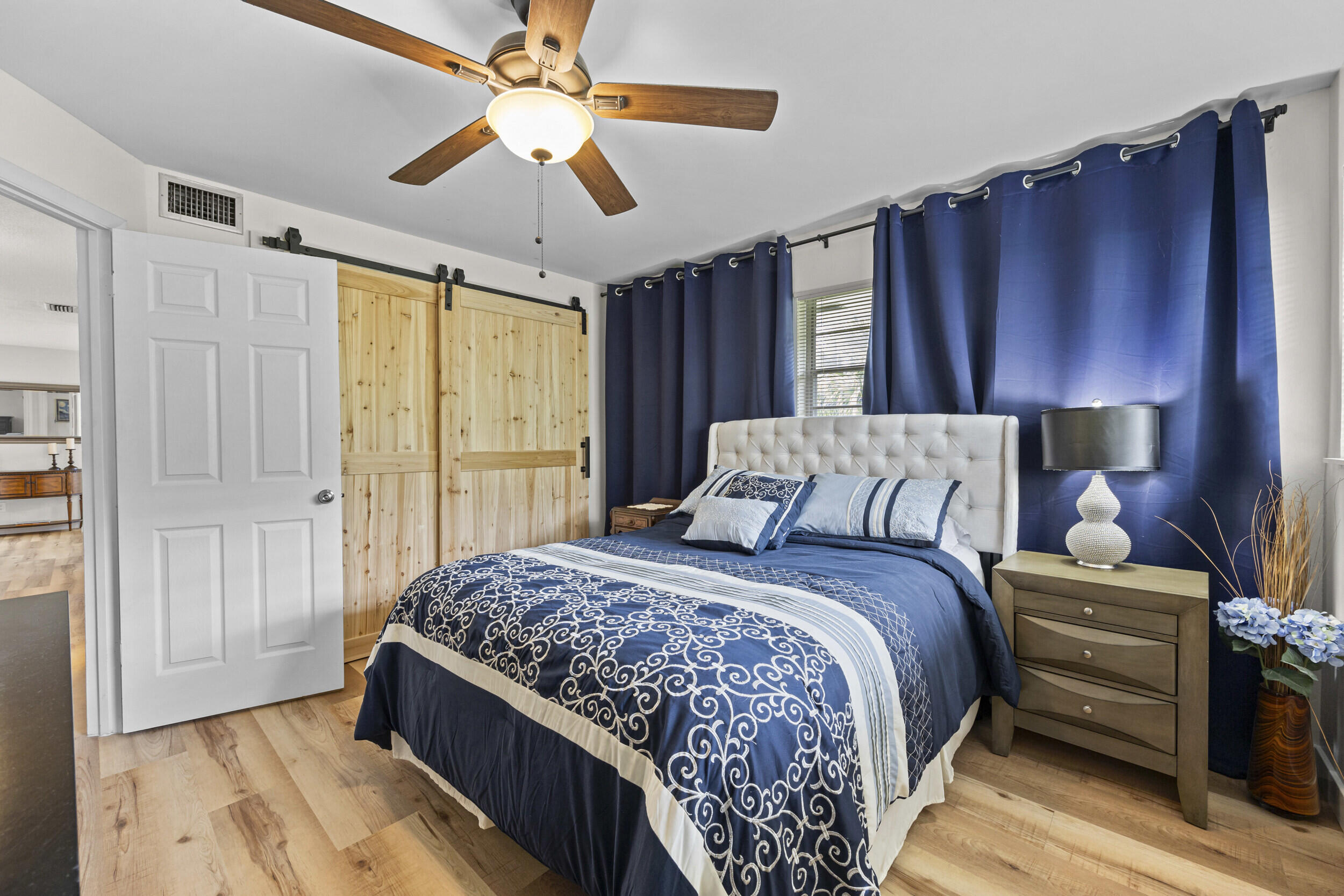 2929 Southeast Ocean Boulevard, Unit 10510 Stuart, FL 34996 - Photo 17 of 37 a bedroom with bed and window