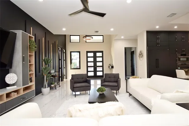 a bathroom with a granite countertop sink a mirror and shower