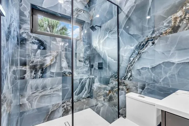 a bathroom with double sink and a mirror