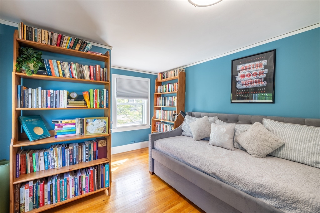 9 Parkman Road Reading, MA 01867 - Photo 10 of 34 a bedroom with a book shelf and a book shelf